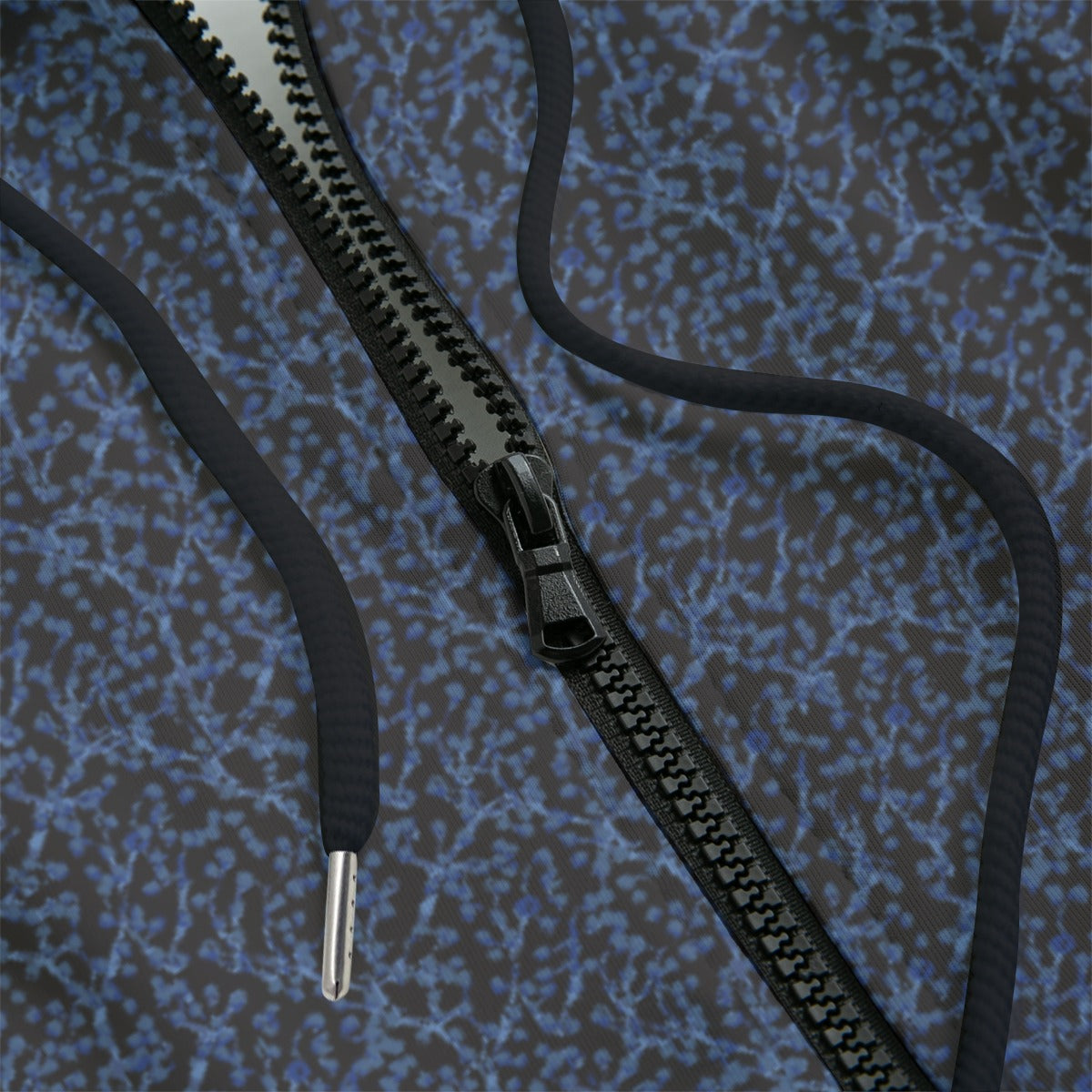 Close-up of a black zipper hoodie with a blue and gray design