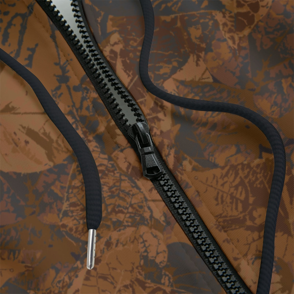 Front detail of a black zipper camouflage-patterned hoodie on a black background