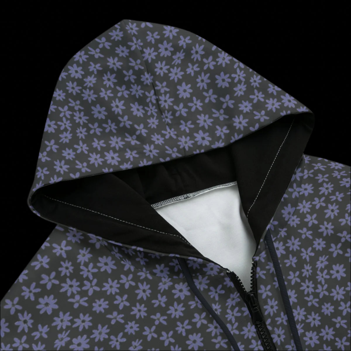 Front top of black zipper floral patterned hoodie on black background