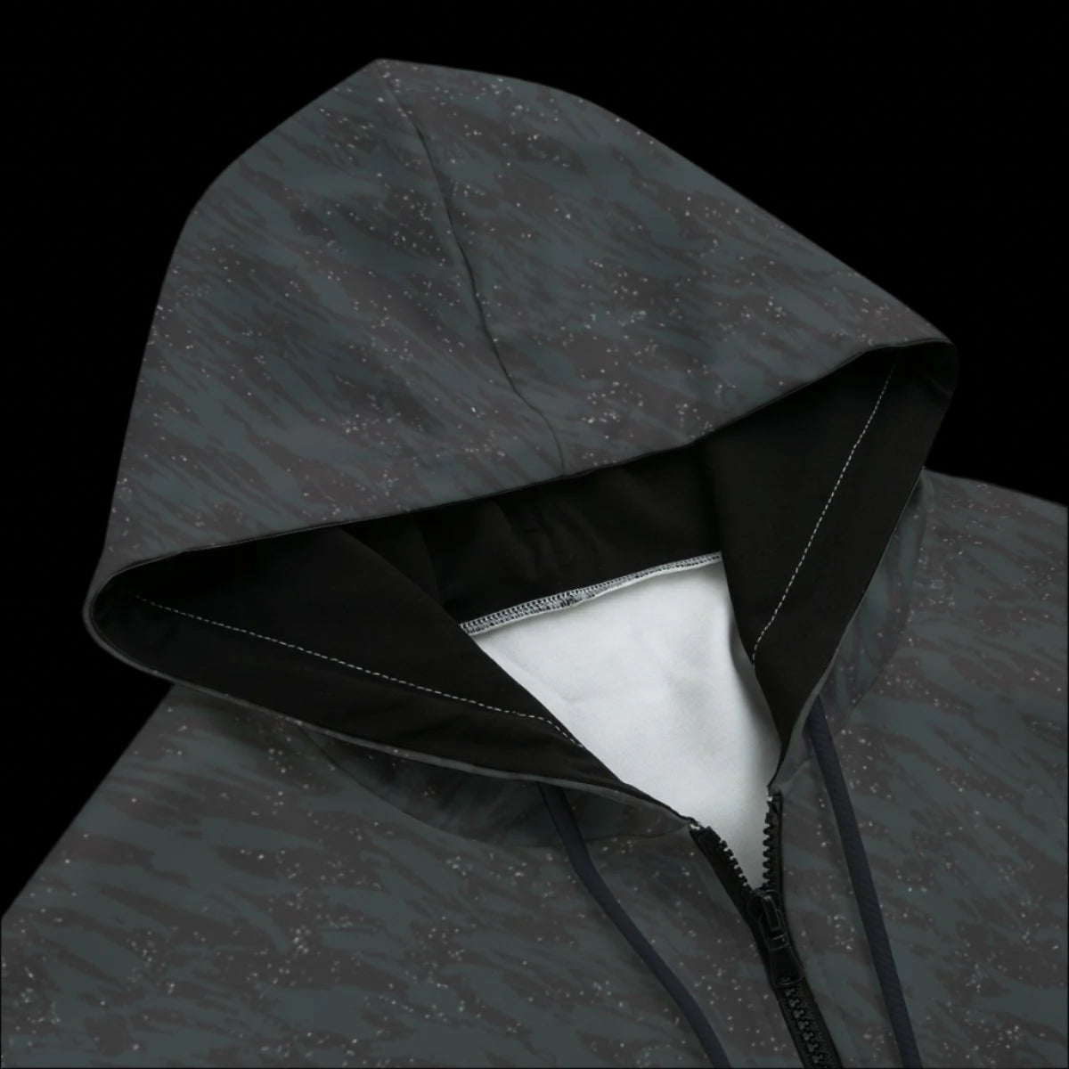 Front top of a textured gray black zipper hoodie on a black background
