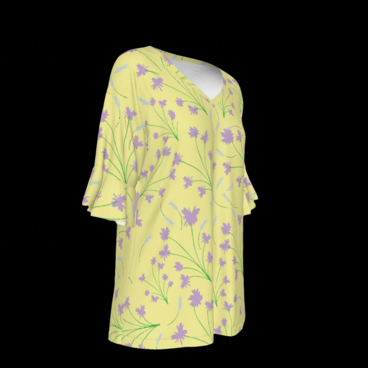 Right side of yellow blouse with floral pattern on a black background