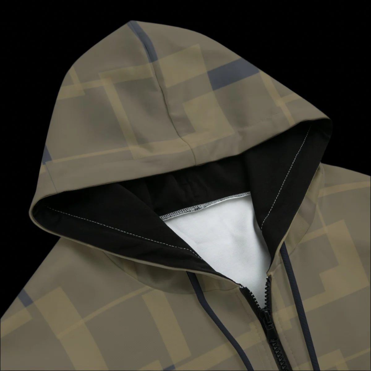 Close-up of a patterned hooded jacket with geometric design on a black background