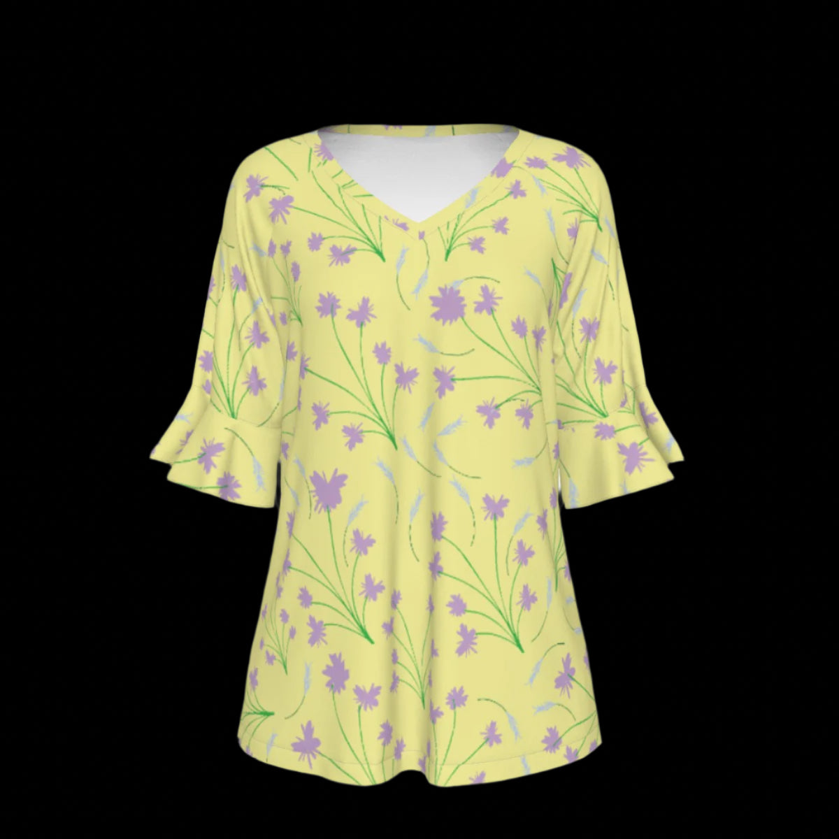 Front of yellow blouse with floral pattern on a black background