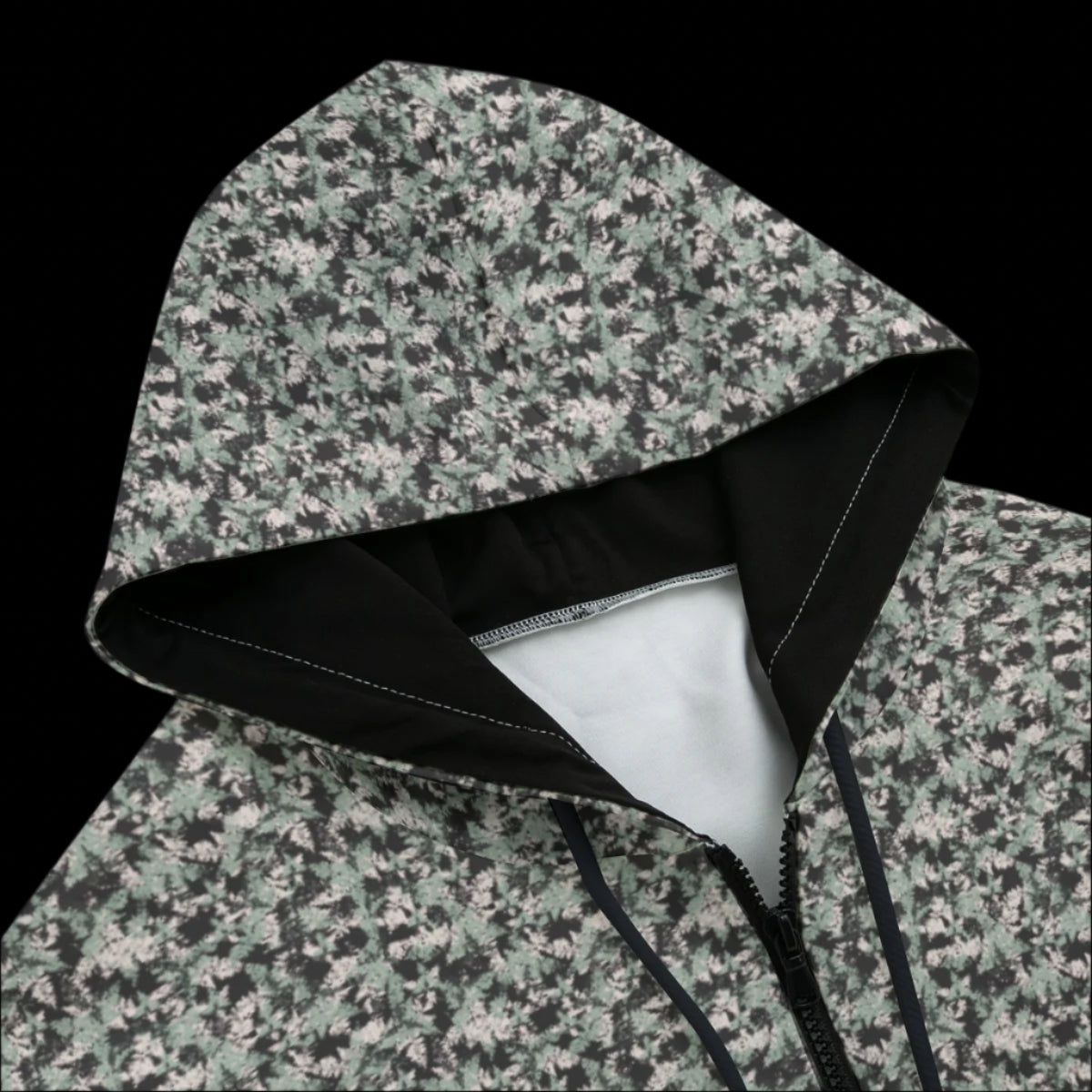 Front top of Hoodie with black and white pattern on a black background