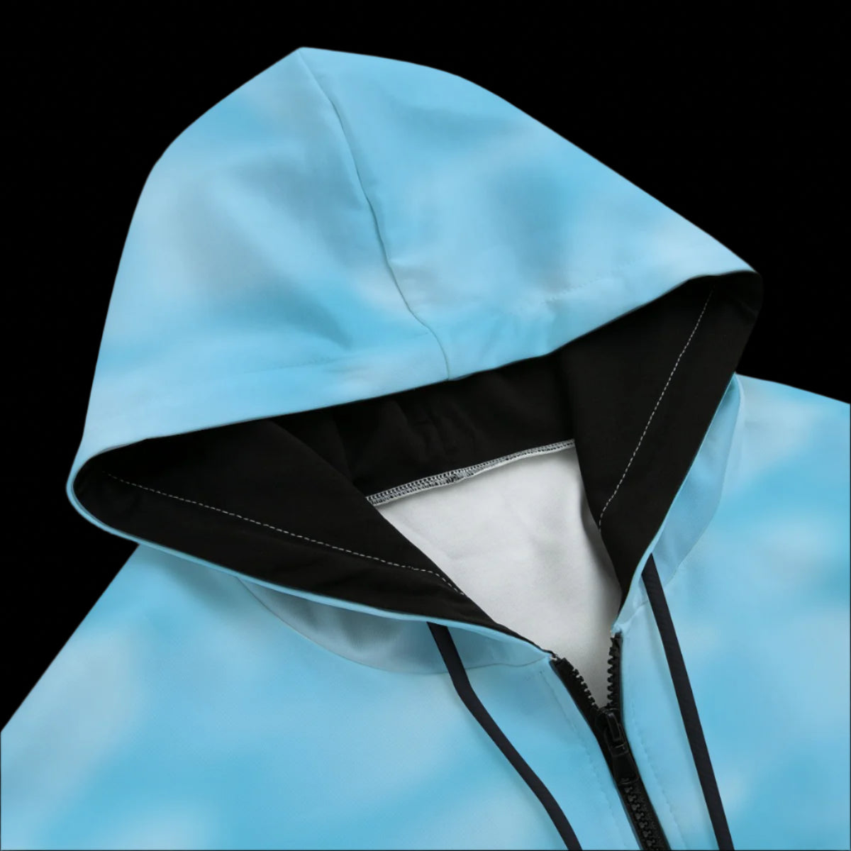 Front top of blue hoodie with black drawstrings on a black background