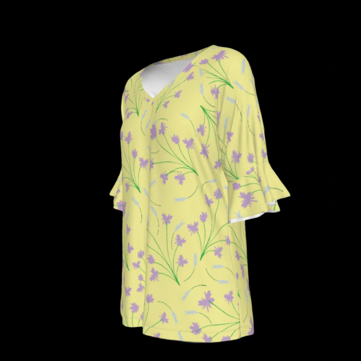 Left side of yellow blouse with floral pattern on a black background