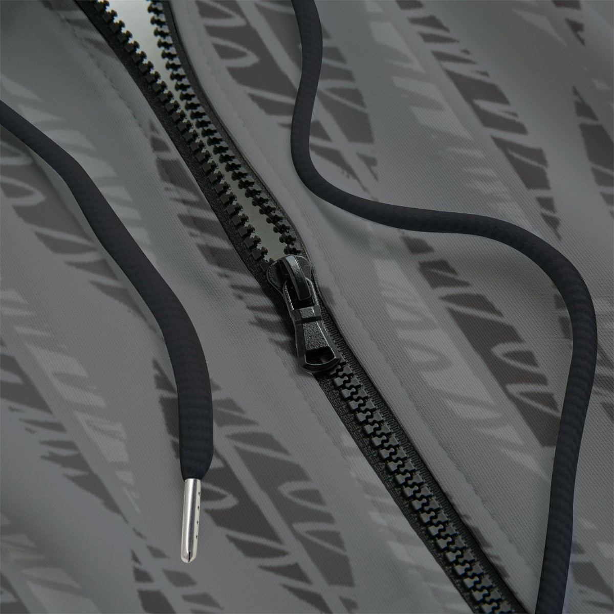 Close-up of a grey hoodie with a black zipper