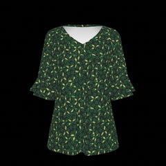 Front of green patterned blouse on a black background