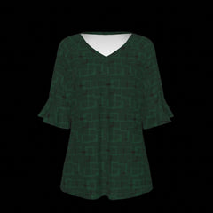 Front of green blouse with geometric pattern on a black background