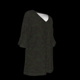 Right side of dark green blouse on a black background