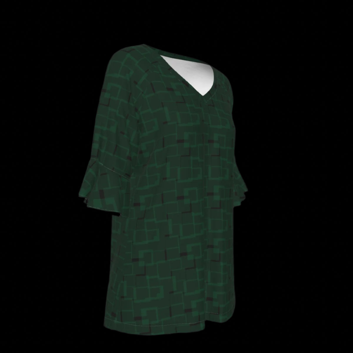 Right side of green blouse with geometric pattern on a black background