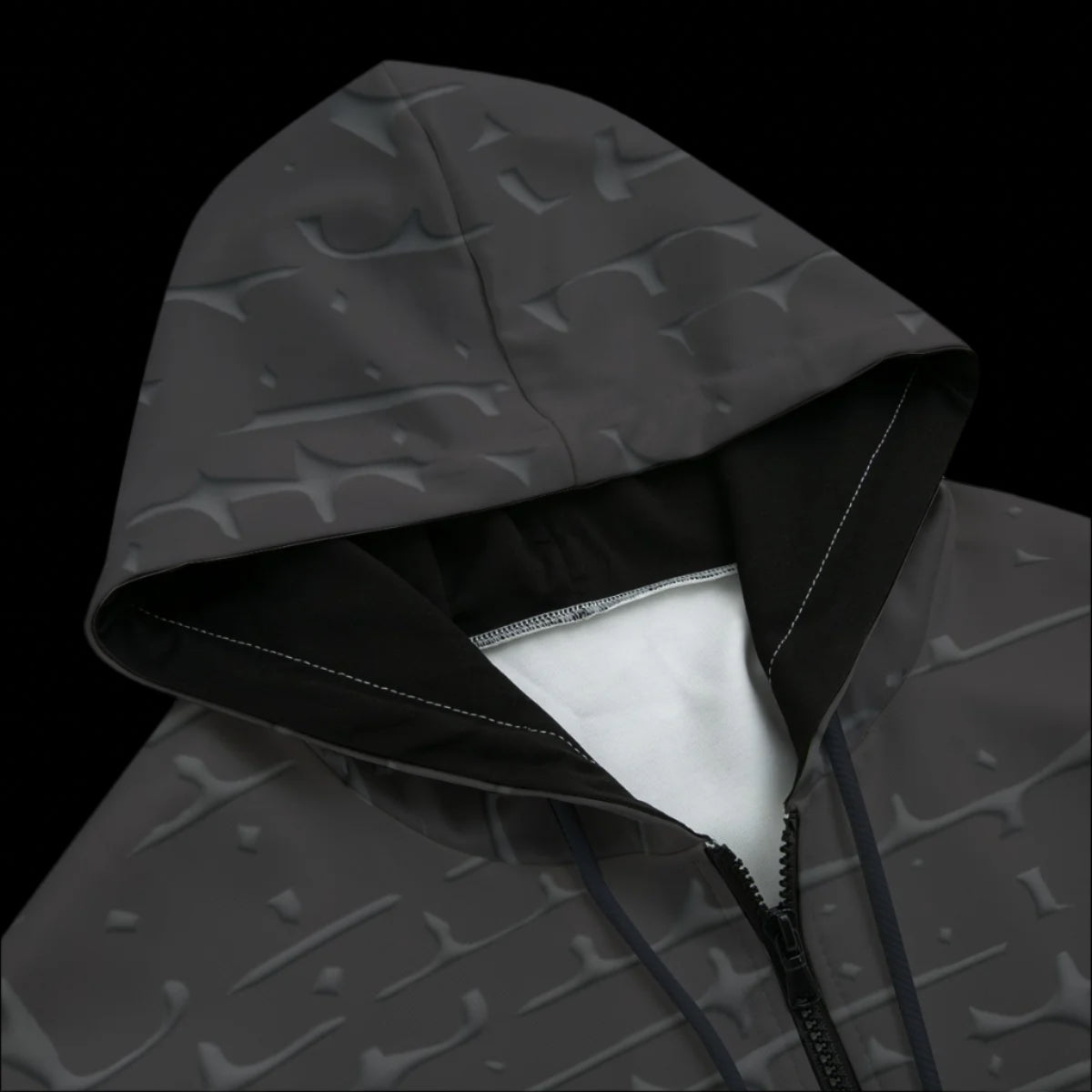 Top front of a black zipper hoodie on a black background