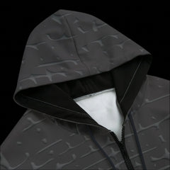 Top front of a black zipper hoodie on a black background