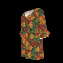 Left side of floral patterned top with red, orange, and green colors on a black background