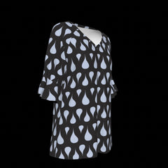 Right of green leaf patterned blouse on a black background
