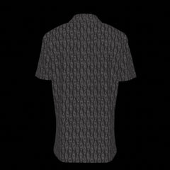 Back of a black patterned button down short sleeve shirt on a black background