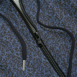 Close-up of a black zipper hoodie with a blue and gray design
