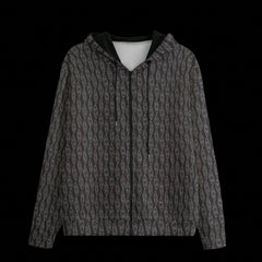 Front of black patterned hoodie on a black background