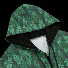 Front top of a green leafy patterned zipper hoodie on a black background 