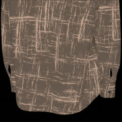 Bottom of back of brown patterned shirt shown from front and back on a black background