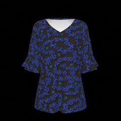 Fron of black blouse with blue floral pattern on a black background