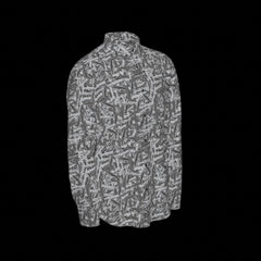 Right side of a patterned long sleeve shirt on a black background