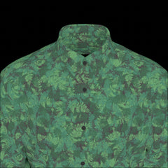 Front top of green camouflage shirt on a black background