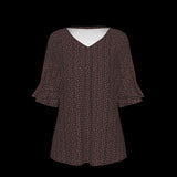 Front of green leaf patterned blouse on a black background