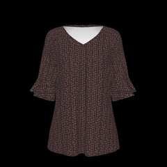 Front of green leaf patterned blouse on a black background