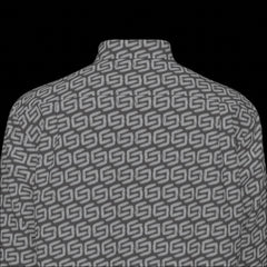 Top back of a patterned long sleeve shirt on a black background