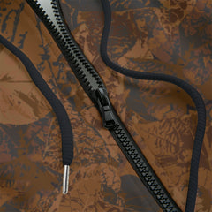 Front detail of a black zipper camouflage-patterned hoodie on a black background