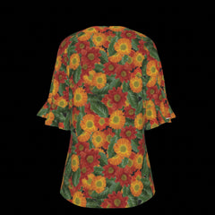 Back of floral patterned top with red, orange, and green colors on a black background