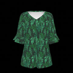 Front of green leaf-patterned blouse on a black background