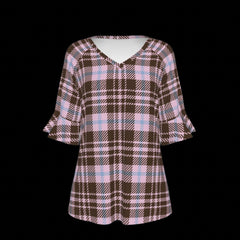 Front of plaid patterned blouse with ruffled sleeves on a black background