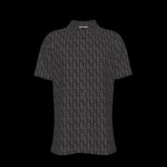 Front of a black patterned button down short sleeve shirt on a black background