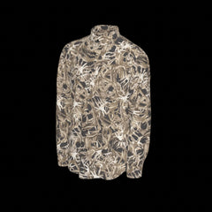 Left side of a camouflage-patterned long sleeve shirt on a black background