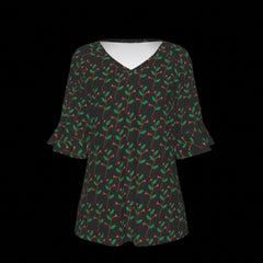 Front of blouse with green leaf pattern on a black background