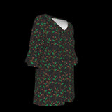 Right side of blouse with green leaf pattern on a black background