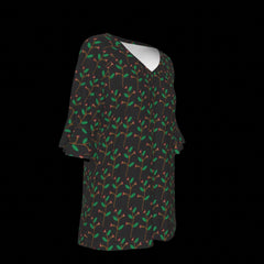 Right side of blouse with green leaf pattern on a black background