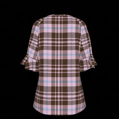 Back of plaid patterned blouse with ruffled sleeves on a black background