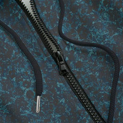 Front detail of black zippered hoodie with  a blue design on a black background