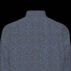 Top back of a green plaid long sleeve shirt on a black background
