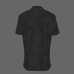 Back of a black textured short-sleeve button-down shirt on a black background