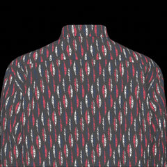 Top back of a patterned long sleeve shirt on a black background
