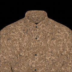 Top front of brown patterned long sleeve shirt on a black background