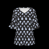 Front of black blouse with light blue pattern on a black background