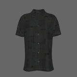 Front of a black textured short-sleeve button-down shirt on a black background