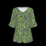 Front of green floral blouse with a black background