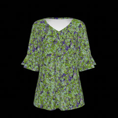 Front of green floral blouse with a black background