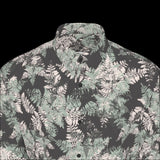 Front top of floral patterned shirt on a black background